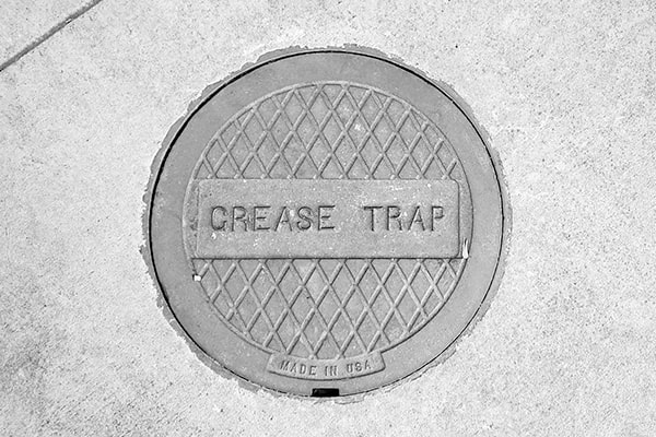 the process of grease trap pumping involves removing built-up grease and oil from the trap to prevent blockages and foul odors